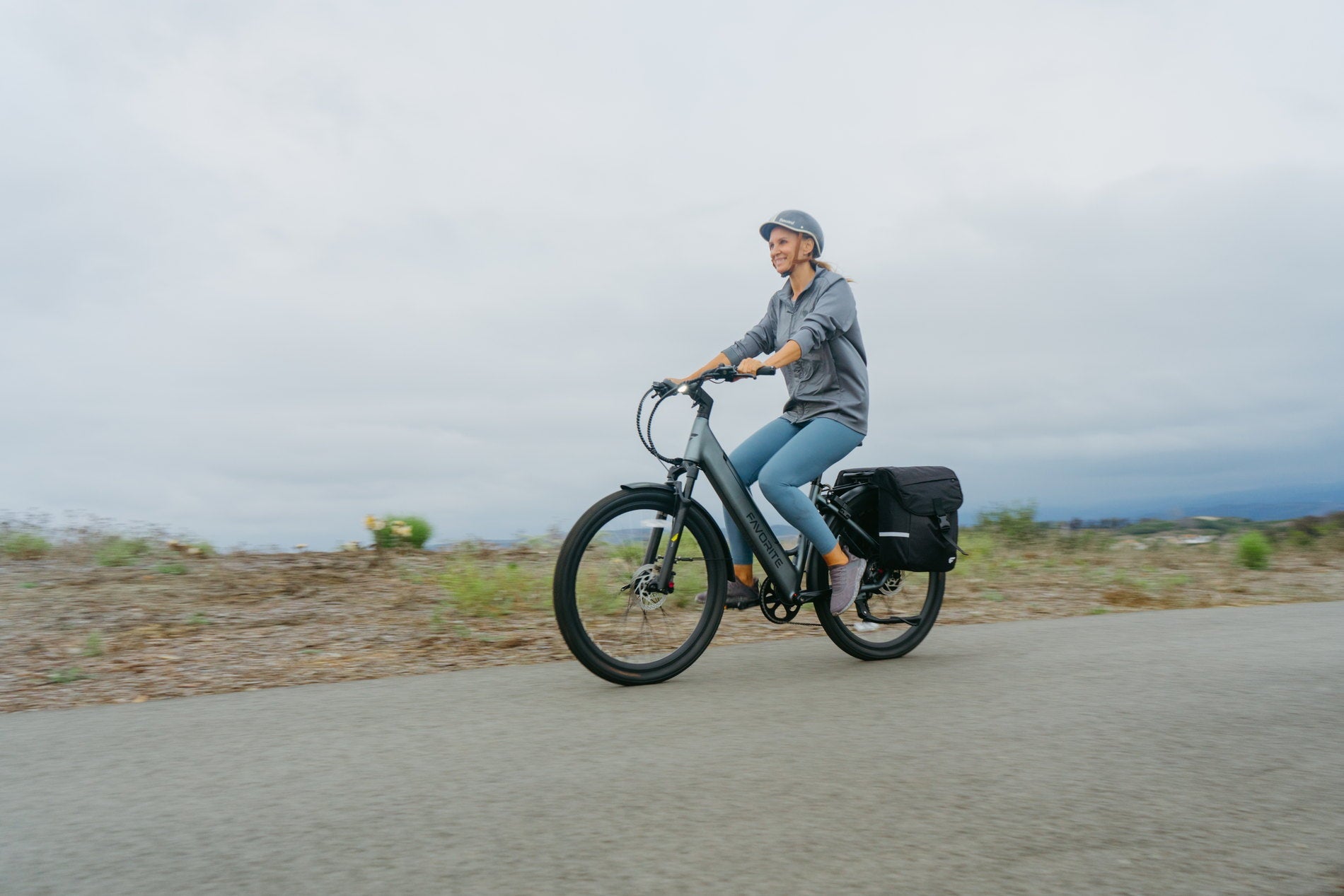 A rider enjoying a relaxed ride on a FavoriteBikes Hybrid CSC electric bike