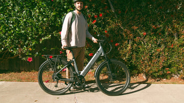 FavoriteBikes rider wearing a helmet while standing with an e-bike before a ride.