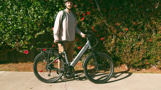 FavoriteBikes rider wearing a helmet while standing with an e-bike before a ride.