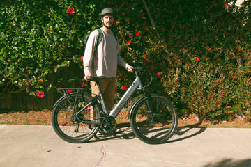 FavoriteBikes rider standing with an e-bike before a weekend ride, illustrating a pre-ride checklist.