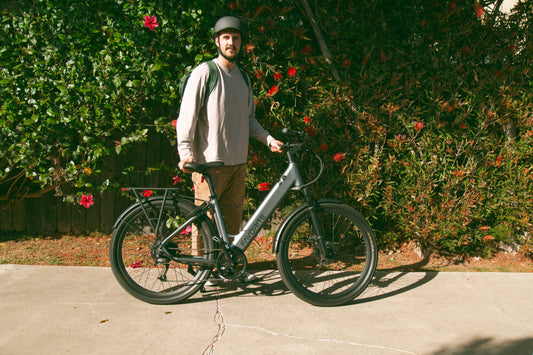 FavoriteBikes rider standing with an e-bike before a weekend ride, illustrating a pre-ride checklist.