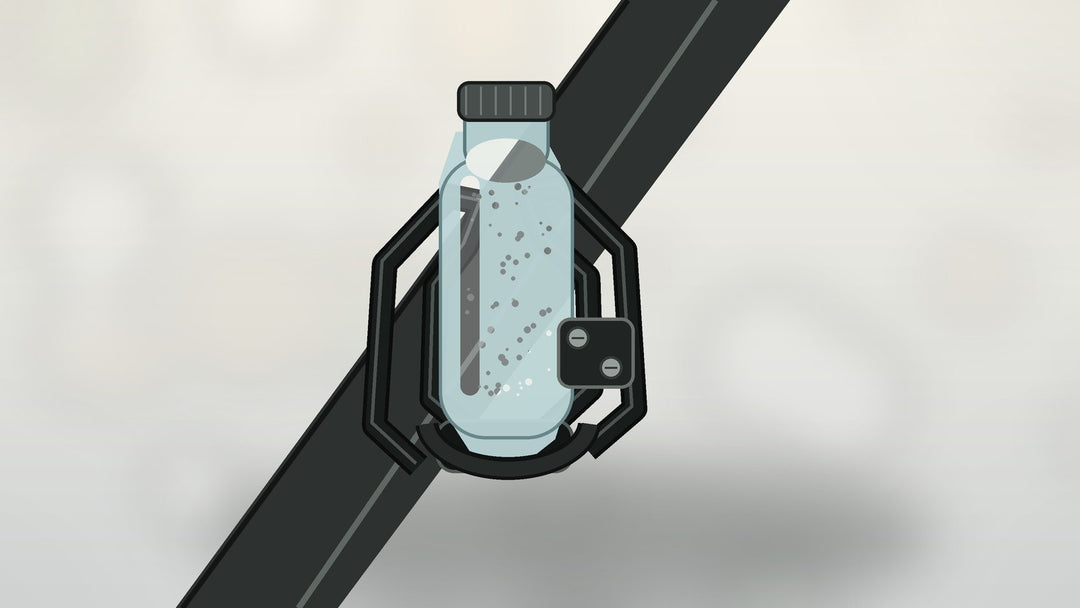 Water bottle secured in a bottle cage mounted on an e-bike frame