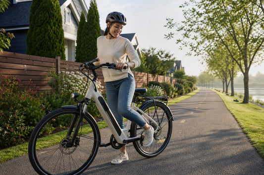 Adult rider stepping through a comfortable step-through electric bike on a bike path