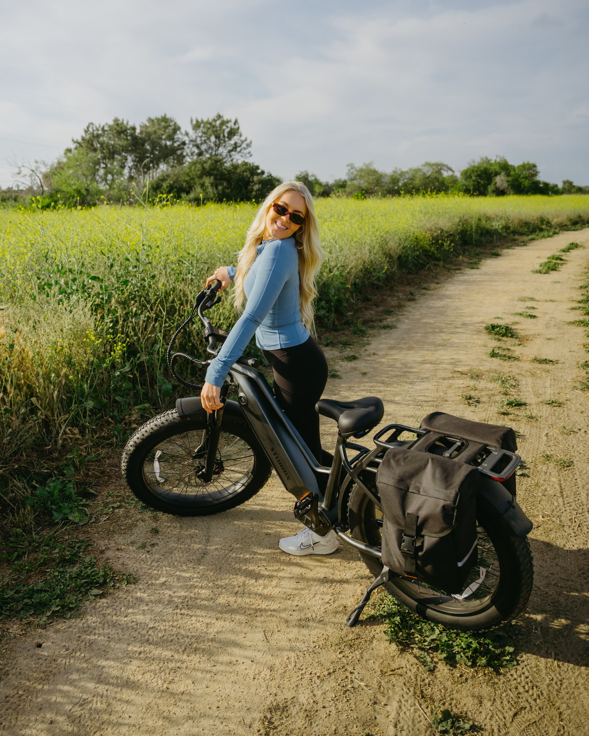 A rider with a FavoriteBikes StormX fat-tire electric bike on a dirt trail