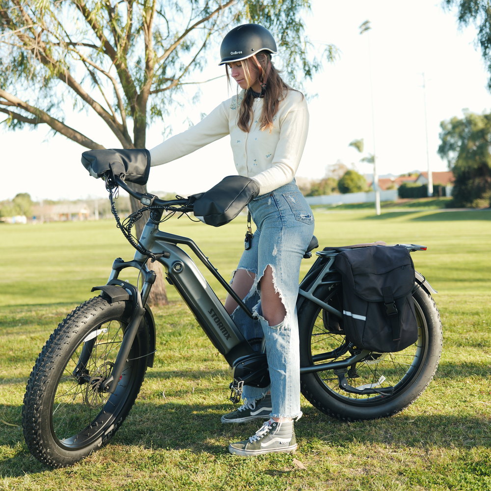 A FavoriteBikes StormX rider with her electric bike in a park