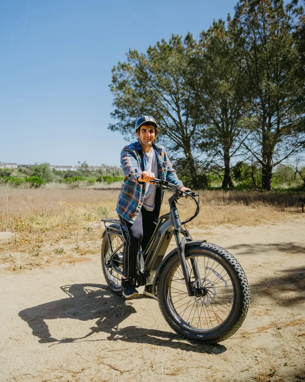 FavoriteBikes rider on a fat-tire electric bike on a dry unpaved trail