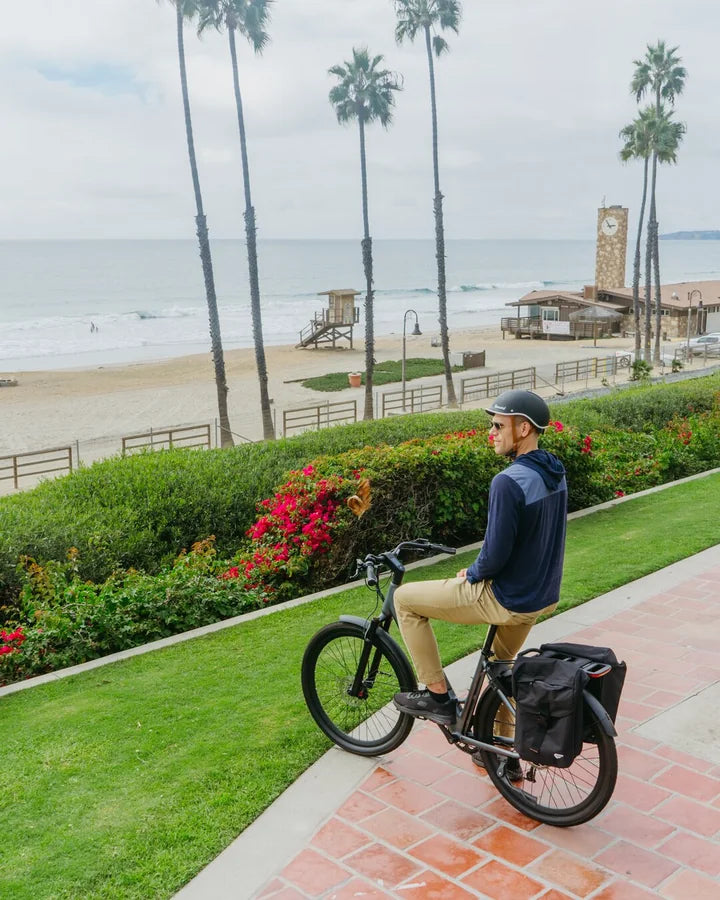 Rider on a Hybrid CSC e-bike near the coast